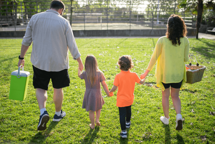 a family of 4 walking away from the camera